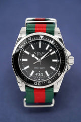 Shop Gucci Dive Black Dial Two Tone NATO Strap Watch For Men - YA136206 in USA