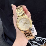 Shop Guess Cubed Analog Gold Dial Gold Steel Strap Watch For Women - GW0606L2 in USA