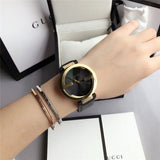 Gucci Interlocking G Gold Black Dial Black Leather Strap Unisex Watch - YA133326 Buy Now By Gucci